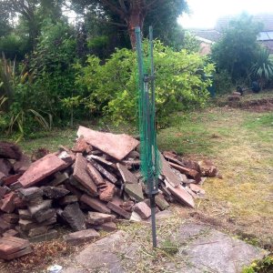 A large pile of rubble in the garden during the clearance works.