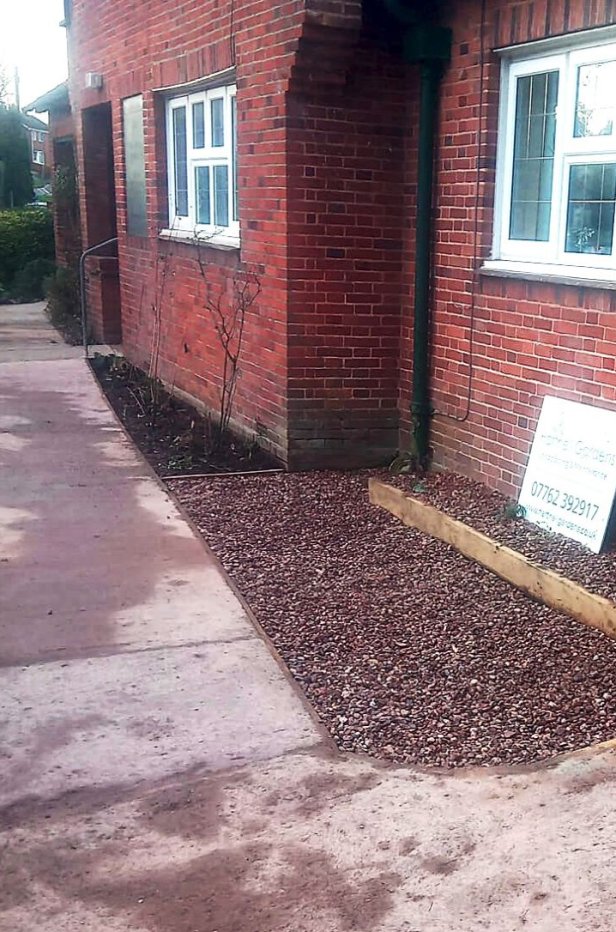 Improving accessibility with a new 25 metre concrete sloping path links the three alms-houses together, with decorative gravel paths and rose beds either side.