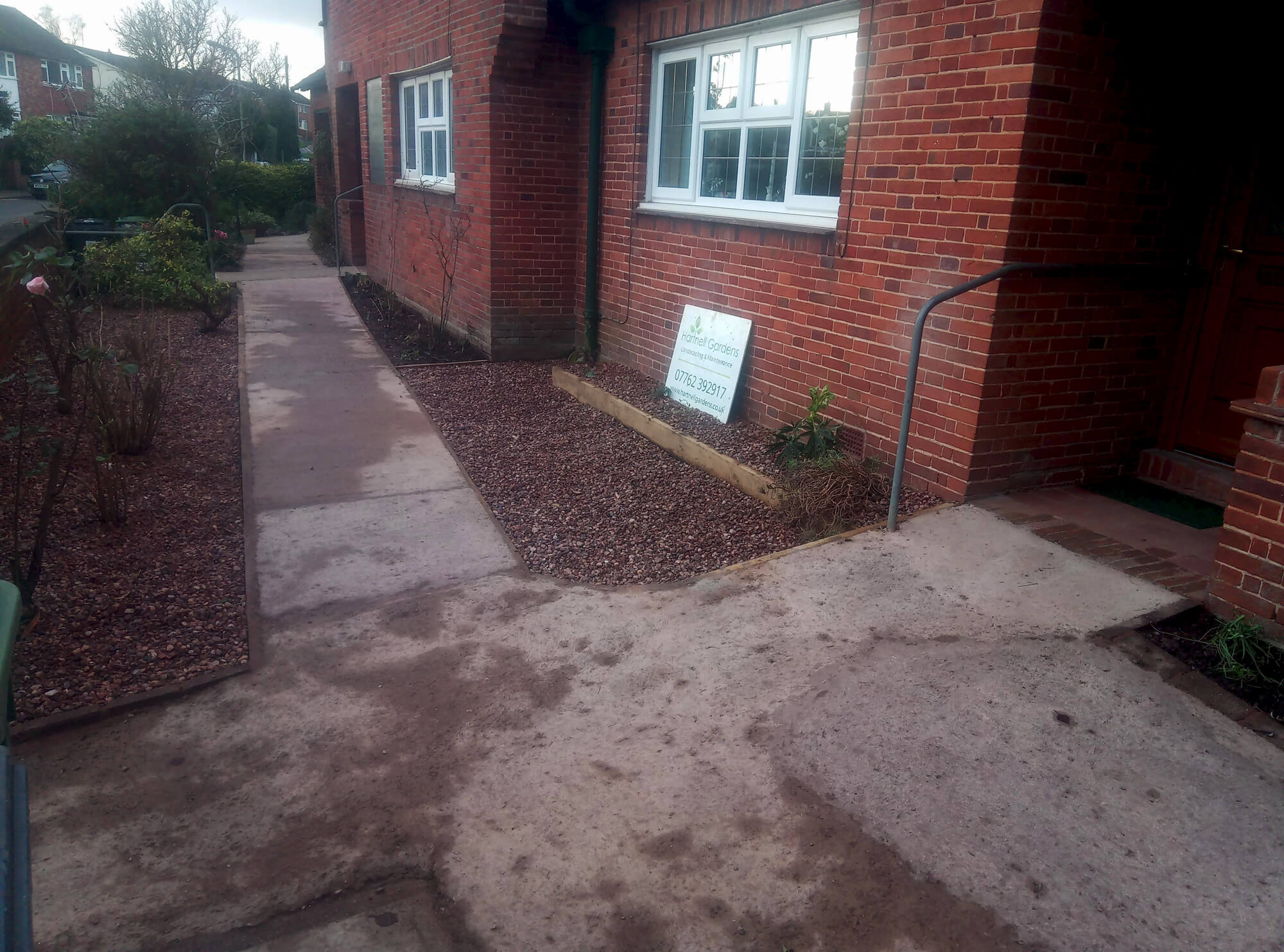 Improving accessibility with a new 25 metre concrete sloping path links the three alms-houses together, with decorative gravel paths and rose beds either side.