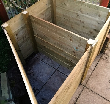 Custom-built, timber compost bins - one triangular and the other square - to fit a particular area in the garden.